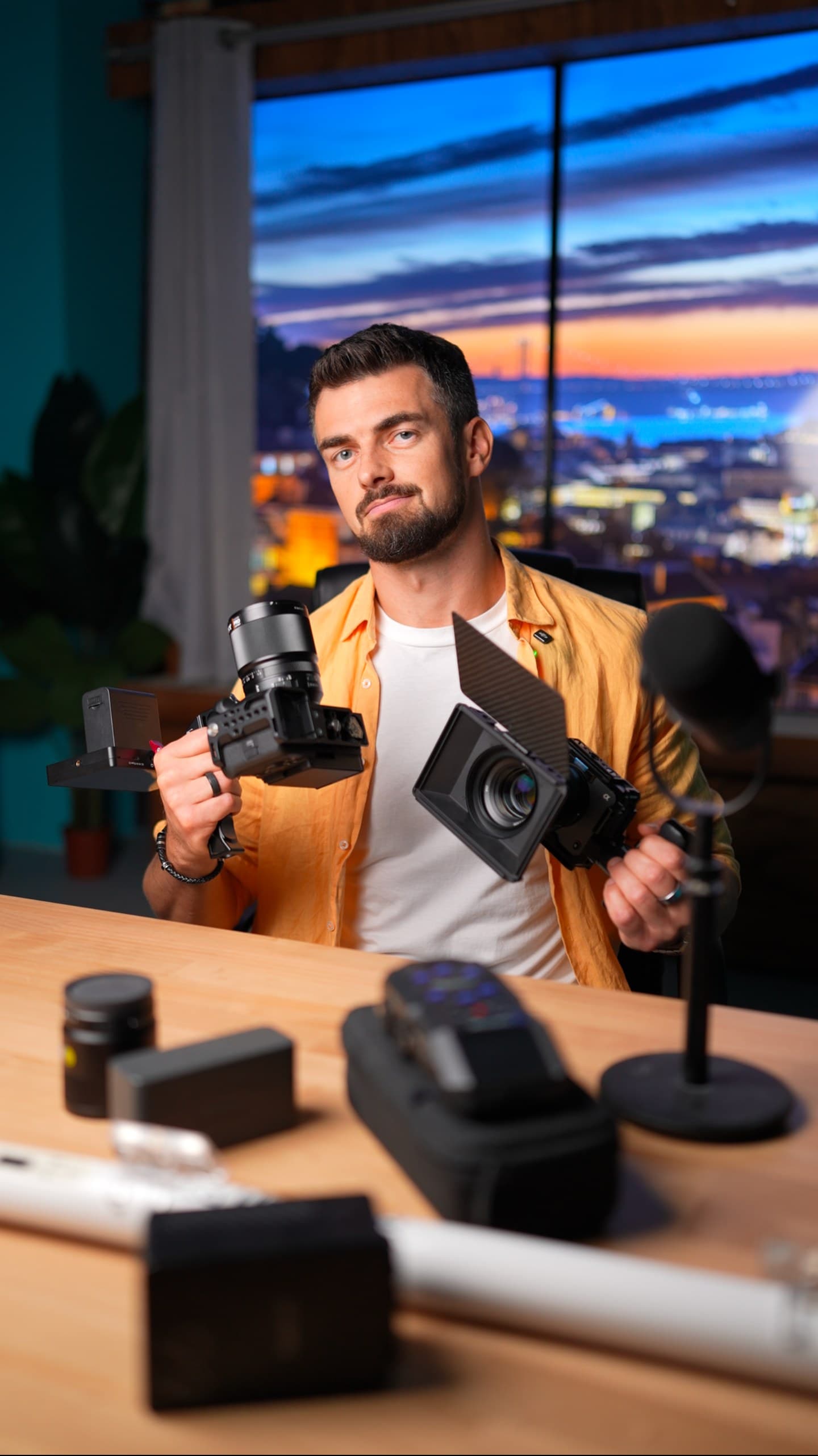 Content creator with cameras at Film Büro studio with Lisbon sunset view