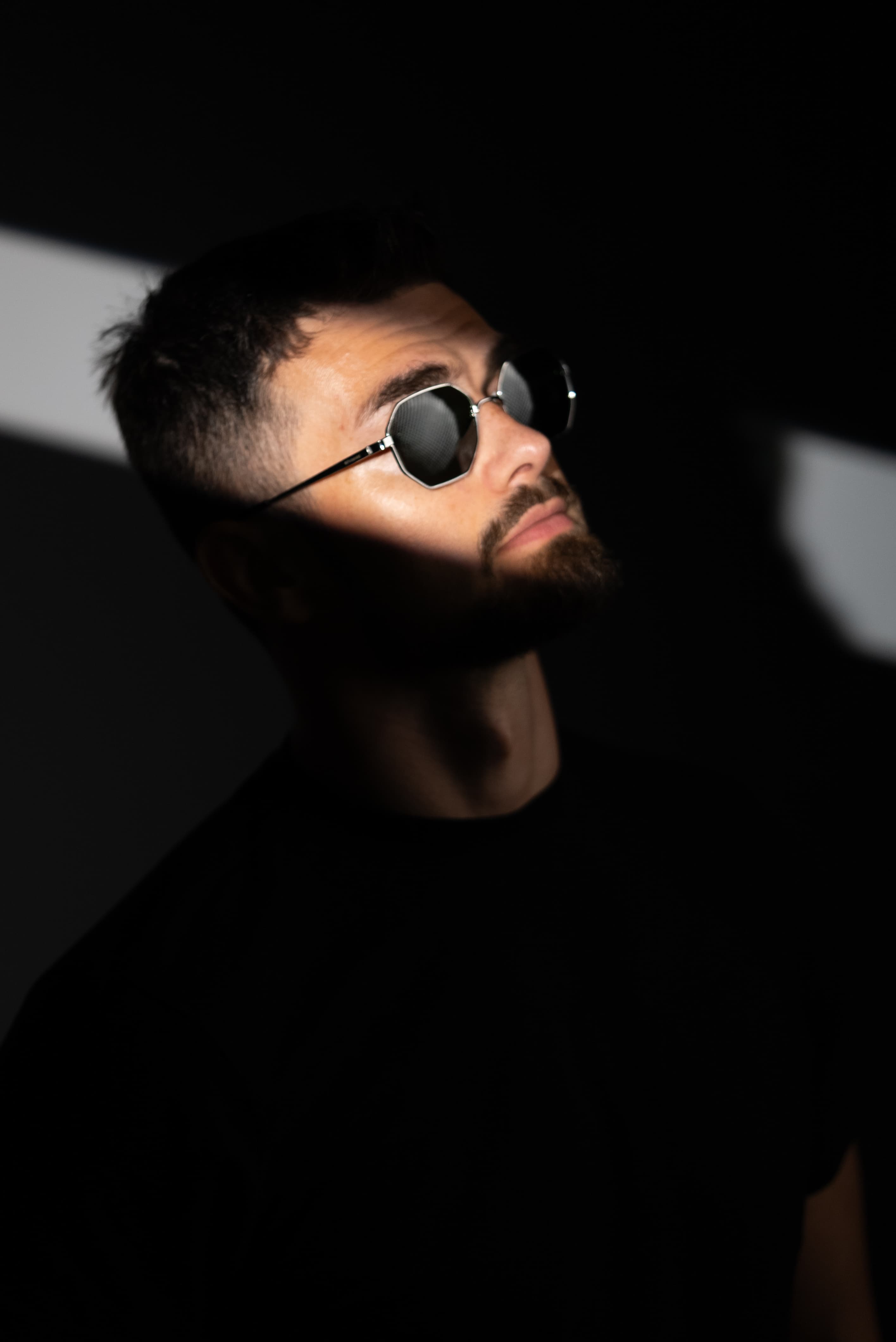 Artistic portrait with dramatic shadow lighting