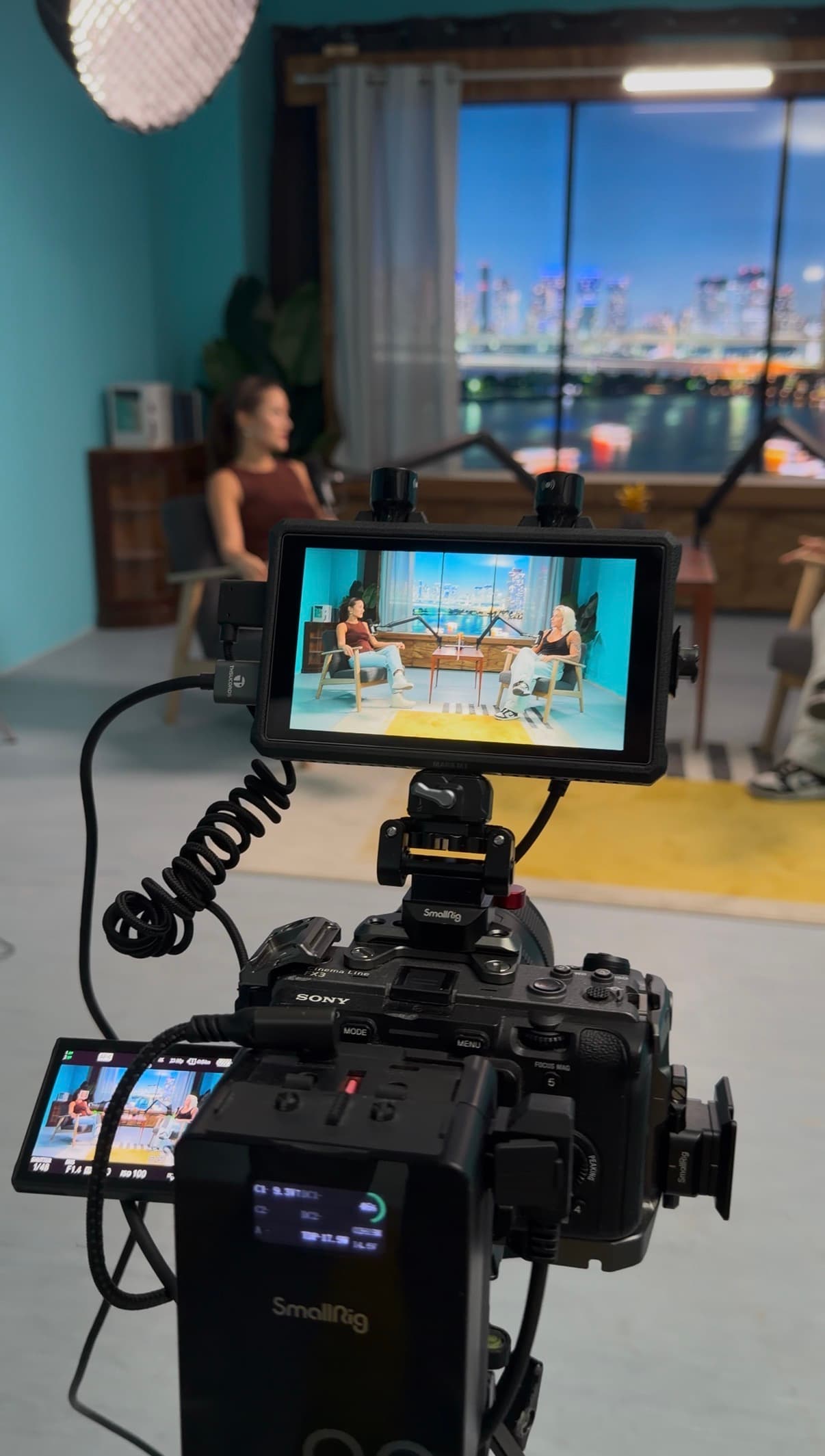 Professional podcast recording setup with Netflix-approved cameras and Infinite Digital Window in Lisbon studio